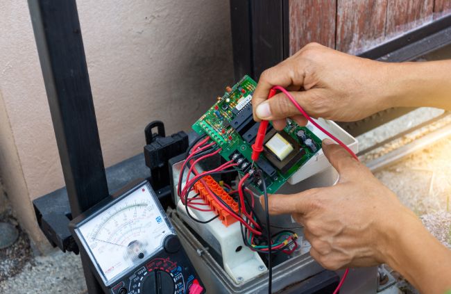 Automatic gate repairs using a multimeter on a gate control board – expert automatic gate servicing by Auto Gate Guys Sydney Automatic gate repairs using a multimeter on a gate control board – expert automatic gate servicing by Auto Gate Guys Sydney