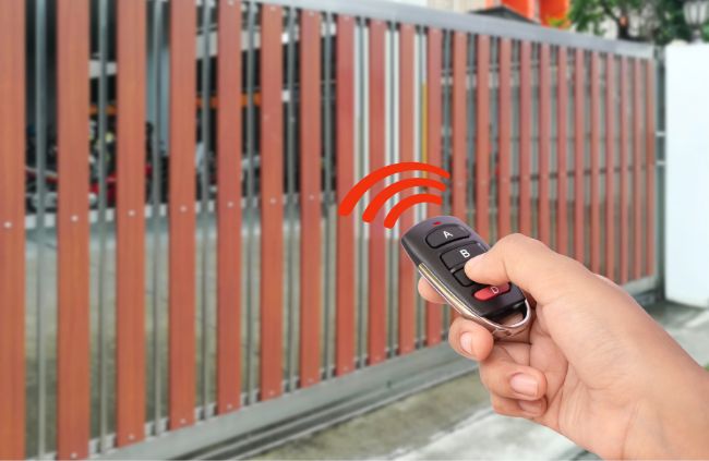 Wireless gate opener controlling a modern sliding gate installed by Auto Gate Guys Sydney, offering convenience and security for Sydney homes Wireless gate opener controlling a modern sliding gate installed by Auto Gate Guys Sydney, offering convenience and security for Sydney homes