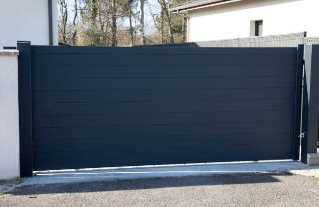 Custom automatic sliding gate with modern panel design installed by Auto Gate Guys Sydney specialists in driveway gates Custom automatic sliding gate with modern panel design installed by Auto Gate Guys Sydney specialists in driveway gates